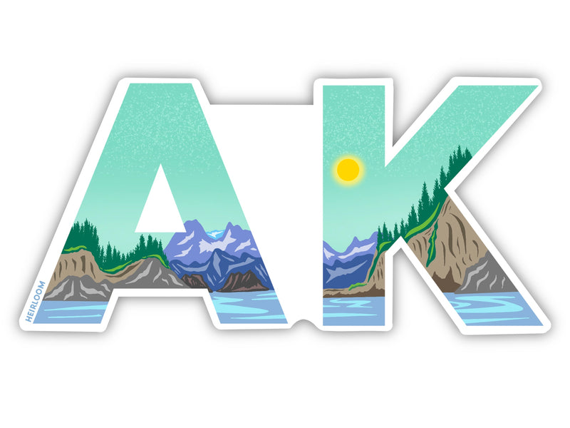 A sticker that has an A and a K that has art in the middle featuring mountains the ocean and an aqua green sky with a sun.